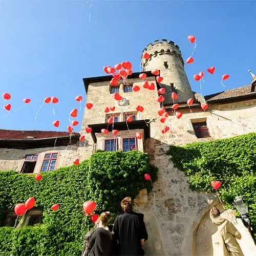 castle, stone walls, ivy, balloons, wedding scene